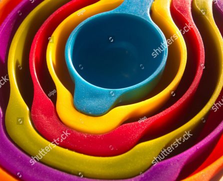 stock-photo-a-set-of-measuring-spoons-made-of-colored-plastic-group-of-steel-measuring-spoons-closeup-kitchen-597545837-edit
